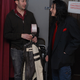 Tommy and I backstage, me carrying his stuff